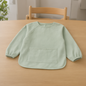 Long-Sleeve Feeding Bib — in use